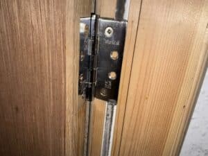 Defective fire door identified during a fire risk assessment in a Lancashire residential building